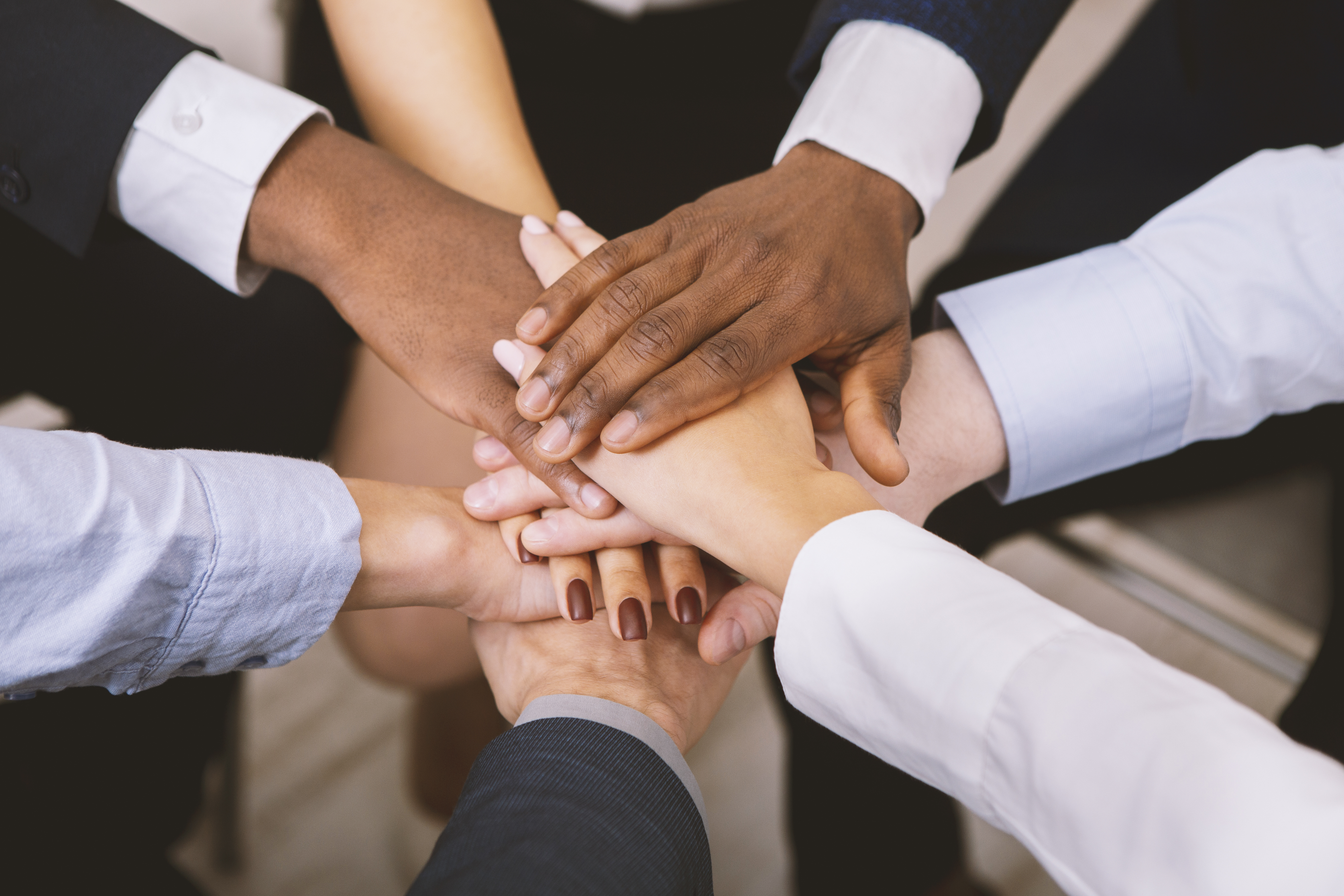 Team with all hands in